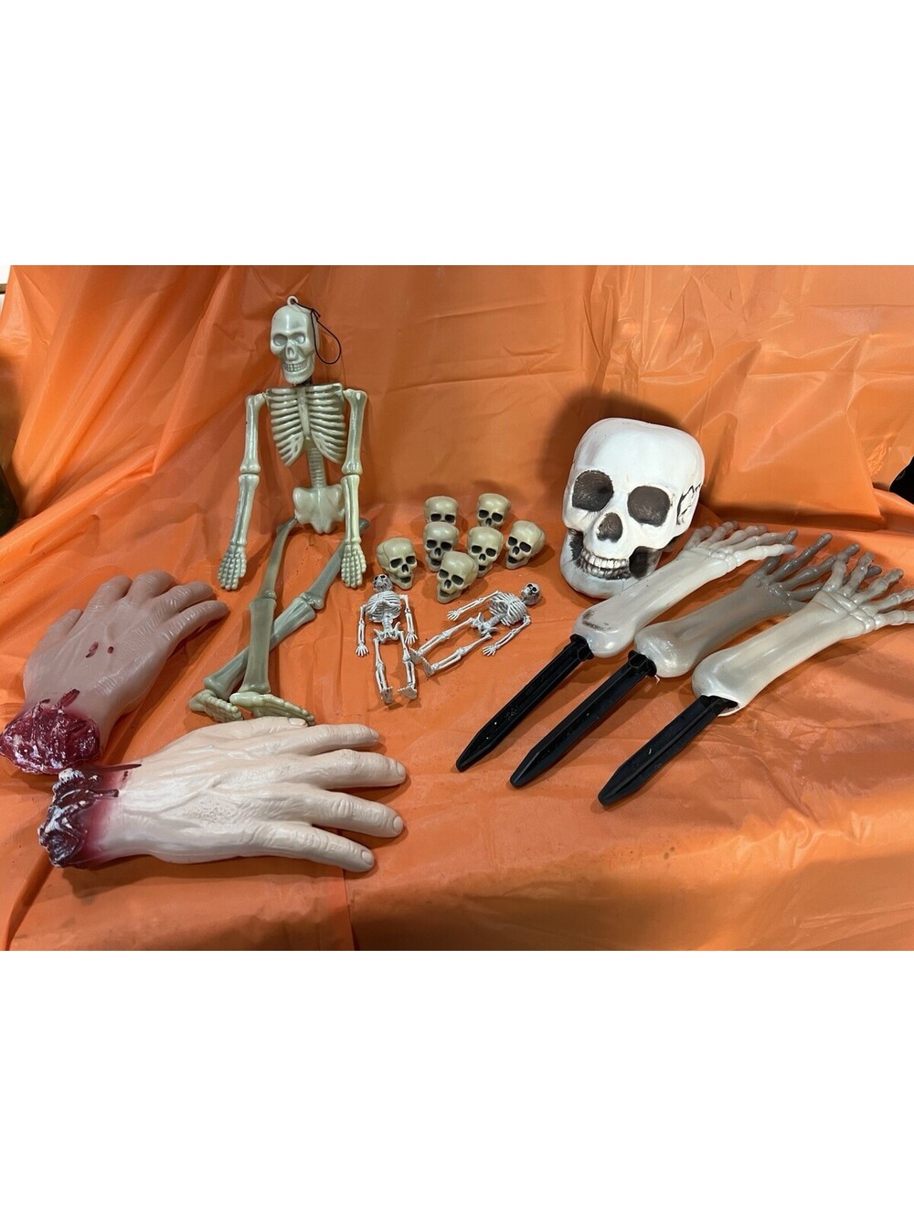 Lot of Plastic Skeleton and Skulls And Hands Halloween Mix Props,